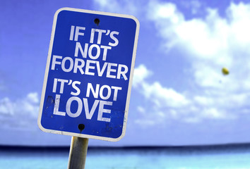 If It's Not Forever It's Not Love sign with a beach background