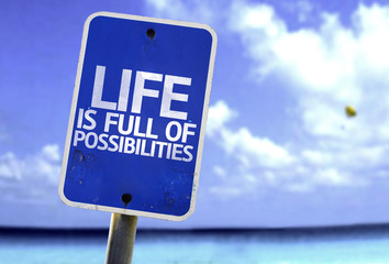 Life is Full of Possibilities sign with a beach on background
