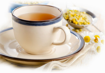 Herbal tea with chamomile flowers.