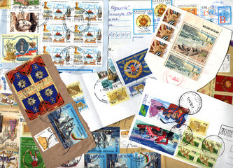 Fototapeta na wymiar Background of postage stamps. Scraps