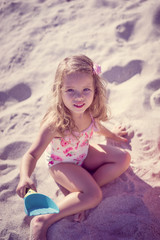 Cute baby girl at the beach