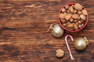 Bowl Of Whole Nuts. Wooden Background