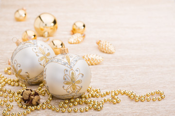 White and gold christmas ball on illuminated background