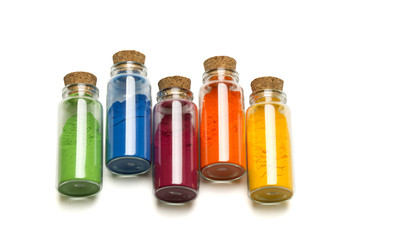 Colored powder in glass bottle