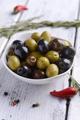 Different marinated olives on table close-up