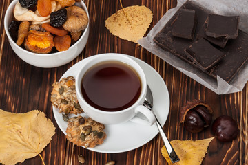 Autumn Concept. Cup Of Tea Or Coffee. Dried Fruits. Dark Chocola