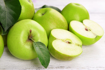 Ripe green apples on wooden background