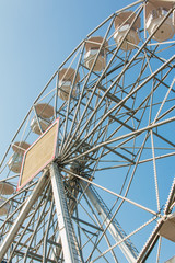 white ferris wheel against blue sky background