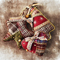 Christmas decoration (handmade toy) over grunge background .