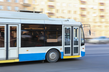 bus goes along street