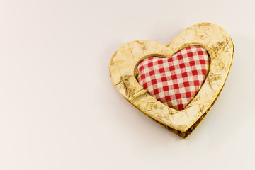 wooden heart, squared textile in the middle