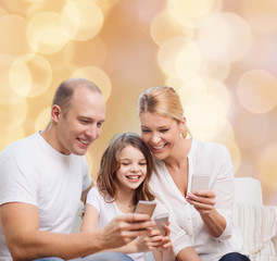 happy family with smartphones