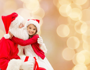 smiling little girl with santa claus