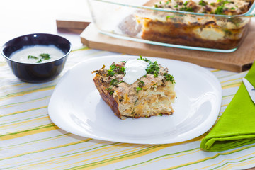 Cauliflower baked with eggs, cheese and dill on top