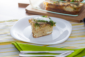 Cauliflower baked with eggs, cheese and dill on top