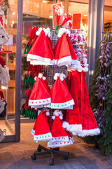 Fototapeta na wymiar Christmas hats on the street on sale