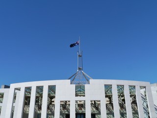 Flag half mast on the Parliament building in Canberra