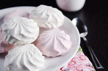 sweet white and pink marshmallows on plate