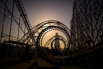 Corkscrew roller coaster at dusk