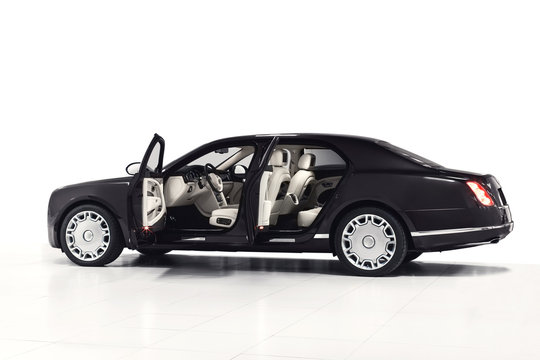 Black prestige sedan side view with open doors