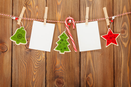 Photo frames and christmas decor on rope