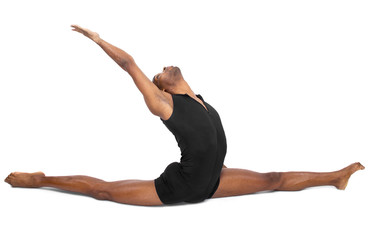male ballet dancer warming up and showing flexibility