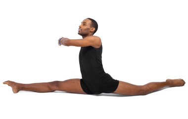 male ballet dancer warming up and showing flexibility