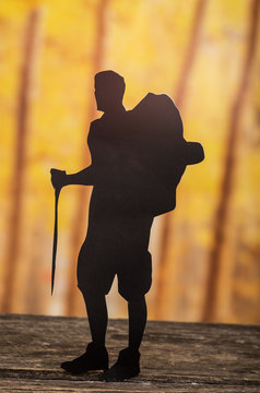 cut out of hiking man silhouette over nature background