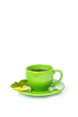 Green mug with lemon and mint
