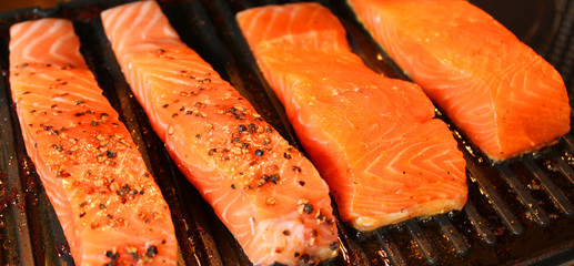 Marinated salmon fillets on the grill