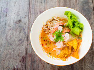 prawn mee or prawn noodles on wooden background