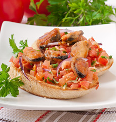 Bruschetta with mussels, cheese and tomatoes