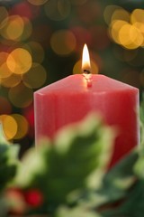 Large red candle burning bright