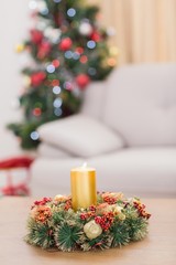 Candle and wreath on table for christmas