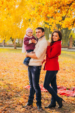 Picture of lovely family in autumn park