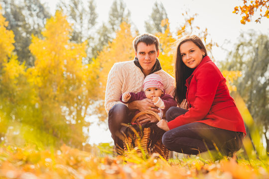 Picture of lovely family in autumn park