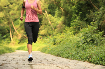 fitness woman runner running on trail