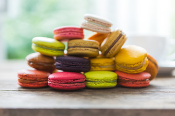 French colorful macarons on wood table