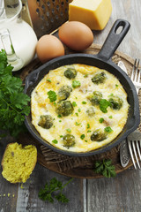 Casserole with brussels sprouts and cheese in a frying pan