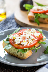 Feta with tomato and rocket sandwich