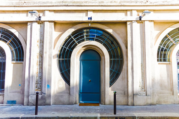 Wood arch entry door in the street of Paris, France - 72771617