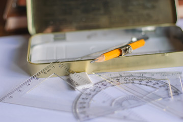 Compasses, pencil and rulers on squared paper © changephoto