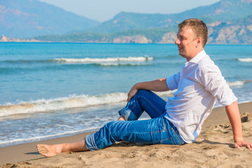 Fototapeta na wymiar successful businessman free vacation by the sea
