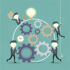 team work concept with cogwheel and businessmen