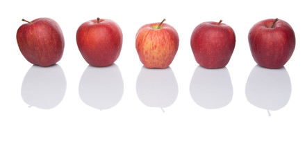 A group of red apples over white background