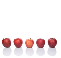 A group of red apples over white background