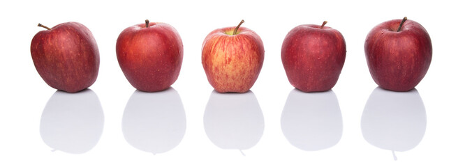 A group of red apples over white background