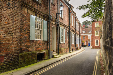 Narrow Street Lined With Renovated Brick Houses
