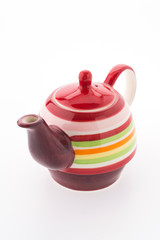 Colorful tea pot isolated on white background