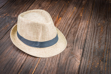 Beach hat on wooden background